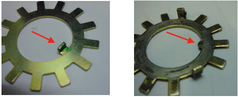 Figure 2: New tang washer with an undamaged locking tab and the subject tang washer with broken locking tab